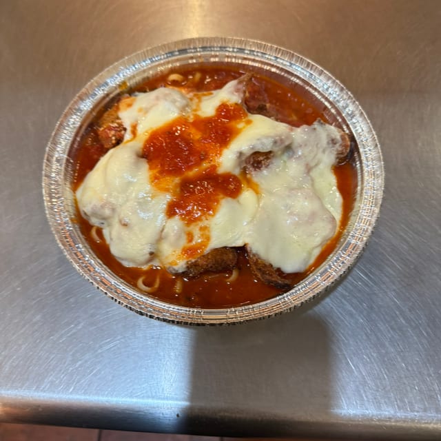 Chicken Parmesan over Linguini.
