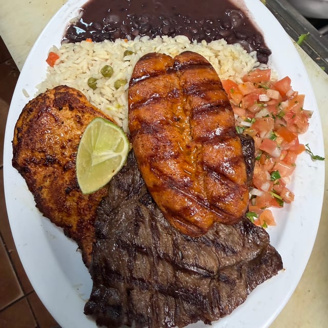 Churrasco a lo Nuestro (Grilled Skirt Steak, Chicken & Chorizo).